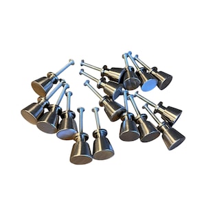 May include: A set of 15 silver cabinet knobs with a round, slightly domed shape. The knobs have a brushed finish and are attached to screws.