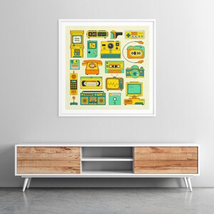 a framed collage of various vintage electronic devices and appliances, including a telephone, radio, camera, and other nostalgic items, all set against a white wall.