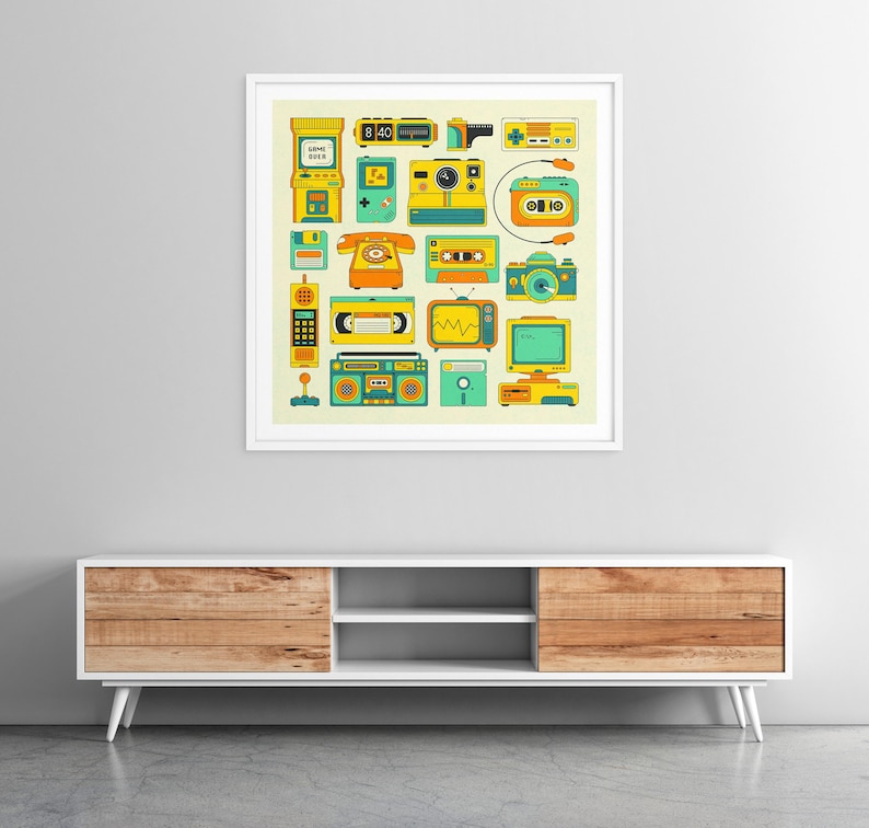 a framed collage of various vintage electronic devices and appliances, including a telephone, radio, camera, and other nostalgic items, all set against a white wall.