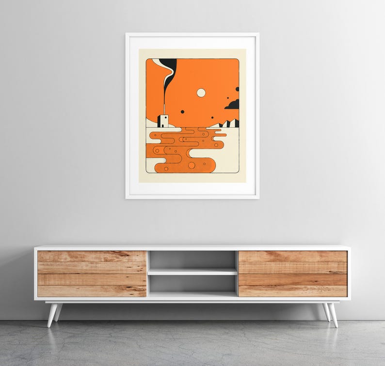 a modern, minimalist design with a wooden cabinet and a framed abstract artwork hanging on the wall above it.