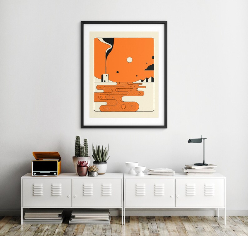 a minimalist interior design with a white cabinet, a framed abstract art print hanging on the wall, and various decorative elements such as potted plants and a lamp.
