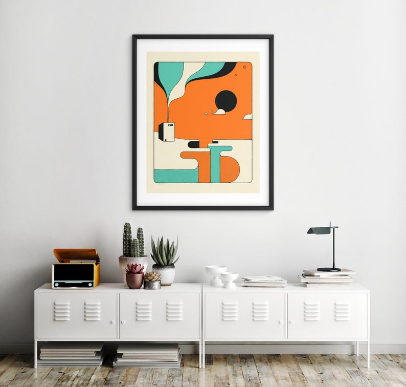 a minimalist interior design with a white cabinet, a framed abstract art piece, and various decorative elements such as potted plants and a lamp.