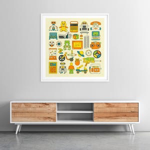 a framed collage of various colorful and whimsical illustrations of toys, robots, and other playful objects, displayed on a wall above a white entertainment center.