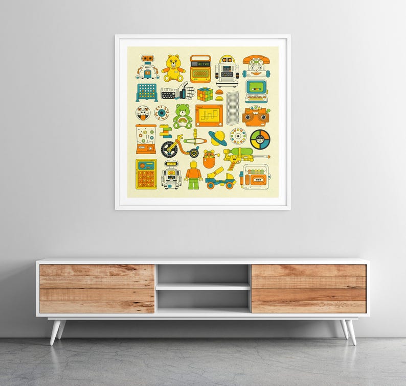 a framed collage of various colorful and whimsical illustrations of toys, robots, and other playful objects, displayed on a wall above a white entertainment center.