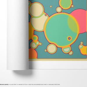 The image is a rolled canvas featuring a vibrant abstract design with colorful circles and shapes.