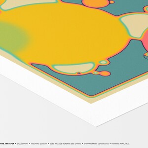 The image is a vibrant abstract artwork featuring a large yellow circle surrounded by smaller circles in various colors, including shades of orange, pink, and blue. The artwork has a unique, fluid, and dynamic appearance, with the colors blending and interacting with each other.