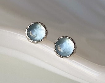 Dainty 4mm Aquamarine Stud Earrings Hand Crafted in Sterling Silver featuring a light-catching hammer-textured bezel. March's birthstone.
