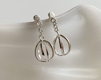 Hand Crafted Sterling Silver Seedling Drop Earrings. Featuring recycled silver and a light-catching hammer texture. Perfect for gifting!