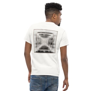 May include: A white short-sleeved t-shirt featuring a large square graphic on the back. The graphic displays a black and white tunnel effect created by concentric squares that diminish in size toward the center, creating a deep perspective.