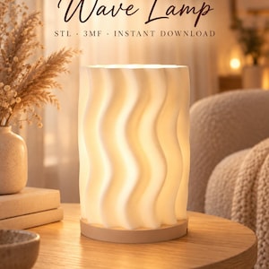 May include: A cylindrical white lamp with a vertical wavy texture, illuminated from within, resting on a circular wooden base. The text Wave Lamp, STL, 3MF, and INSTANT DOWNLOAD is displayed above the lamp in a dark brown script and sans-serif font.