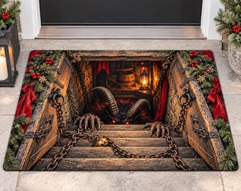 May include: A rectangular doormat featuring a 3D-style illustration of a dark cellar entrance with wooden doors, chains, and a horned creature with glowing red eyes. The border is decorated with green pine branches, red berries, and red bows.