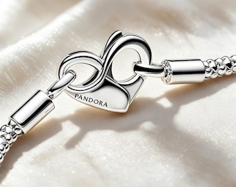 May include: A silver chain bracelet featuring a heart-shaped clasp with an infinity symbol design. The clasp is engraved with the word PANDORA. The bracelet consists of a textured, woven metal link pattern connected to smooth cylindrical end caps.
