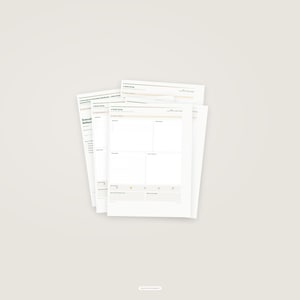 May include: A stack of white paper worksheets with black text and grid lines. The top sheet is titled 'A Daily Focus' and features sections for tasks, priorities, and notes. The pages are organized with clear headings and structured layouts for planning.