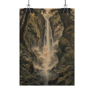 May include: A vertical wall art print featuring a light pink, small, feline-like creature floating in front of a tall, cascading waterfall. The scene is set within a dense, dark green forest with rocky cliffs, lush vegetation, and a calm pool of water.