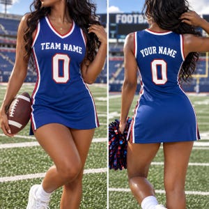 May include: A blue sleeveless jersey dress with white and red trim. The front features the text TEAM NAME above the number 0. The back displays the text YOUR NAME above the number 0. The dress has a V-neckline and a straight hemline.