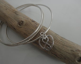 Sterling silver bangles bracelet with a heart infinity charm