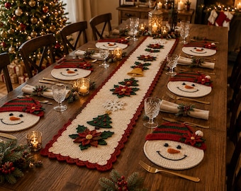 May include: A cream-coloured crochet table runner featuring a red scalloped border and appliqued Christmas motifs including poinsettias, a bell, a snowflake, and trees, paired with matching round crochet snowman placemats with red and green hats.