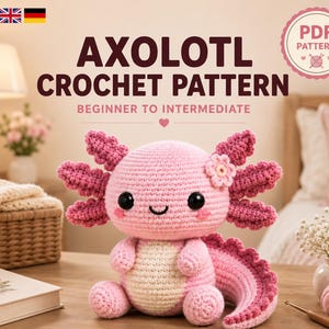 Könnte beinhalten: Ein gehäkeltes Axolotl-Stofftier in Rosa mit cremefarbenem Bauch, schwarzen Augen und einer kleinen Blume auf dem Kopf. Der Text AXOLOTL CROCHET PATTERN BEGINNER TO INTERMEDIATE steht über dem Stofftier, zusammen mit einem PDF PATTERN-Abzeichen.