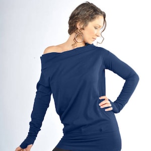 May include: A navy blue long-sleeved shirt with a draped neckline and thumbholes. The shirt is made of a soft, stretchy fabric.