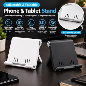 May include: Two foldable phone and tablet stands, one white and one black, featuring adjustable angles, non-slip silicone pads, and a durable ABS construction. The stands include text labels highlighting features like multi-angle adjustment and compatibility for devices between 4.7 and 7.9 inches.