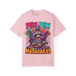 Blossom (soft pink) "Pew Pew Madafakas" raccoon meme T-shirt by SarcasmArt on a white background.