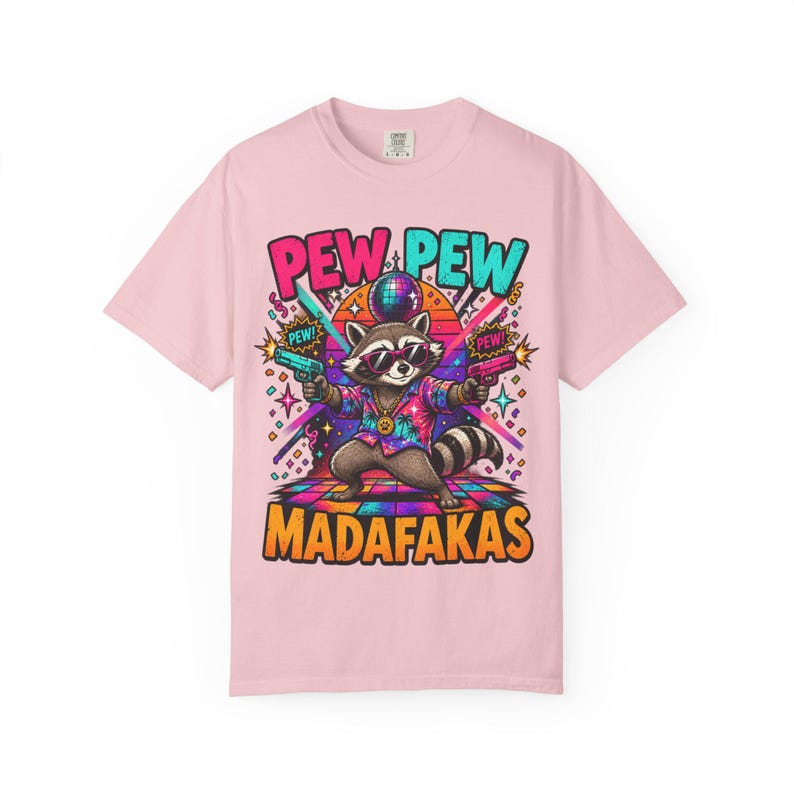 Blossom (soft pink) "Pew Pew Madafakas" raccoon meme T-shirt by SarcasmArt on a white background.