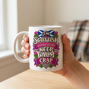 A hand holding the "I'm Scottish, We Dinnae Dae That Keep Calm Crap" funny Scottish mug by SarcasmArt – Scottish banter for your morning coffee.