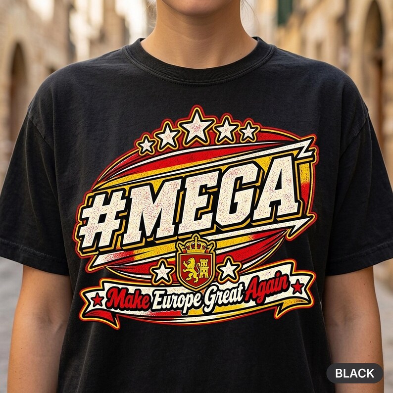 Close-up of the "#MEGA Make Europe Great Again" Spain T-shirt by SarcasmArt in Black: a retro #MEGA sports badge with the red-yellow Spanish flag stripes, a crowned lion shield, stars and a Make Europe Great Again script banner, printed large on a garment-dyed Comfort Colors 1717 tee.