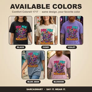 Available colors of the "Pew Pew Madafakas" raccoon meme T-shirt by SarcasmArt: Black, Ivory, Violet, Blue Jean and Blossom, all with the same raccoon print.
