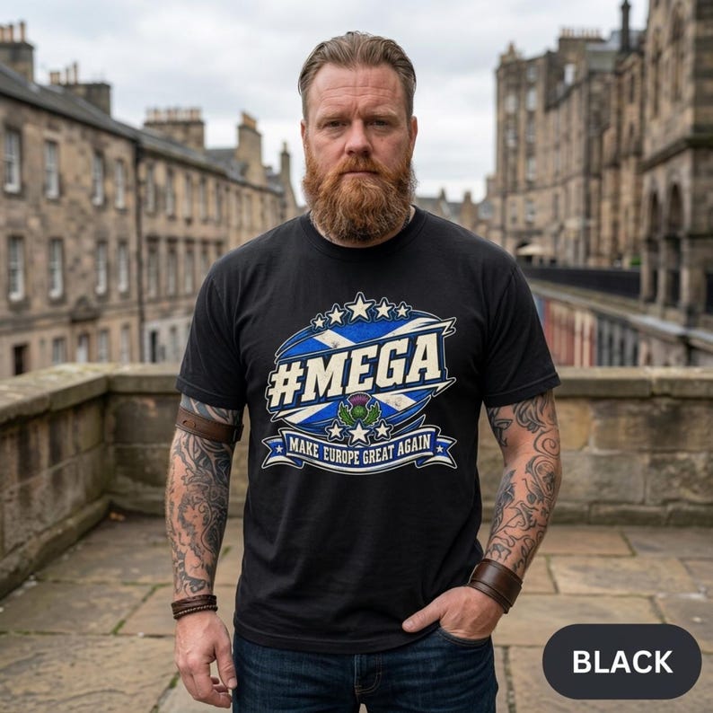 Bearded man on an Edinburgh street wearing the "#MEGA Make Europe Great Again" Scotland T-shirt by SarcasmArt in Black.