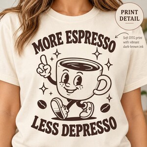 Print detail of the "More Espresso, Less Depresso" retro coffee T-shirt by SarcasmArt: soft, durable front print of the retro coffee cup mascot.