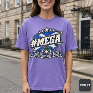 Woman on a stone street with Georgian houses wearing the "#MEGA Make Europe Great Again" Scotland T-shirt by SarcasmArt in Violet.