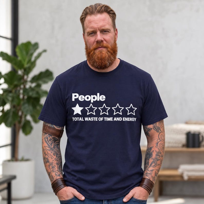 Bearded man wearing the "People – 1 Star, Total Waste of Time and Energy" sarcastic review T-shirt by SarcasmArt in True Navy, a minimalist sarcastic shirt.