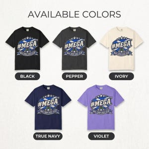 Available colors of the "#MEGA Make Europe Great Again" Scotland T-shirt by SarcasmArt: Black, Pepper, Ivory, True Navy and Violet, all with the same #MEGA badge print.