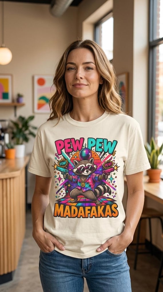 Pew Pew Raccoon Shirt by SarcasmArt – A feral trash panda with laser guns for raccoon fans.
