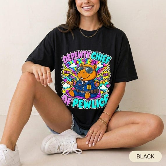 Depewty Chief of Pewlice Capybara Shirt by SarcasmArt – A capybara with a police badge and laser guns: the Depewty Chief of Pewlice.