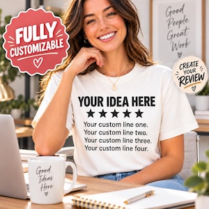 Pode incluir: Uma t-shirt branca de manga curta com o texto preto "YOUR IDEA HERE" acima de cinco estrelas pretas e quatro linhas de texto de marcador de posição: "Your custom line one," "Your custom line two," "Your custom line three," e "Your custom line four."