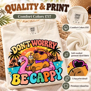 Quality and print of the "Don't Worry Be Cappy" capybara beach T-shirt by SarcasmArt: Comfort Colors 1717, soft-washed garment-dyed fabric, crisp print detail and premium relaxed tee.