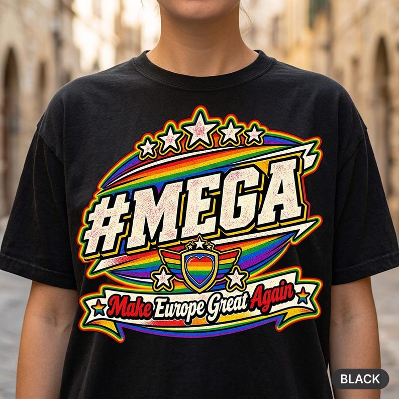Close-up of the "#MEGA Make Europe Great Again" Rainbow Pride T-shirt by SarcasmArt in Black: a retro #MEGA sports badge with rainbow pride stripes, a rainbow heart shield, stars and a Make Europe Great Again script banner, printed large on a garment-dyed Comfort Colors 1717 tee.