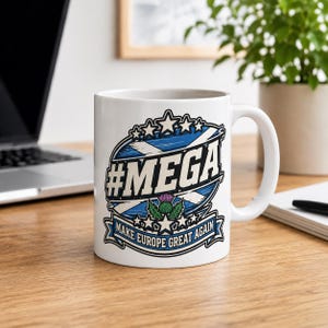 Scotland Mug – Make Europe Great Again Coffee Cup by SarcasmArt. A white ceramic mug featuring a graphic design with a blue and white Scottish flag background, the text #MEGA, a purple thistle illustration, and a banner at the bottom with the text MAKE EUROPE GREAT AGAIN in blue and white.