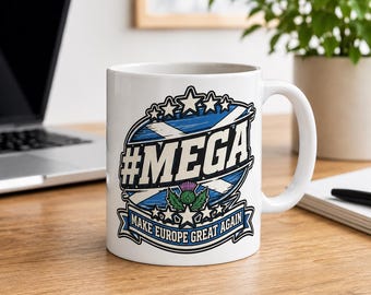 May include: A white ceramic mug featuring a graphic design with a blue and white Scottish flag background, the text #MEGA, a purple thistle illustration, and a banner at the bottom with the text MAKE EUROPE GREAT AGAIN in blue and white.