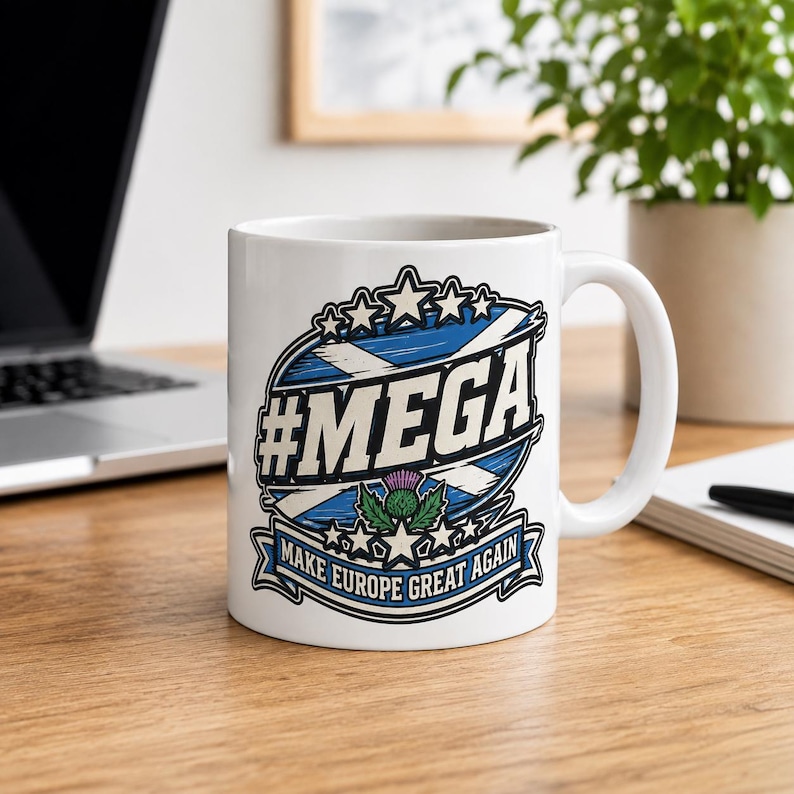 Scotland Mug – Make Europe Great Again Coffee Cup by SarcasmArt. A white ceramic mug featuring a graphic design with a blue and white Scottish flag background, the text #MEGA, a purple thistle illustration, and a banner at the bottom with the text MAKE EUROPE GREAT AGAIN in blue and white.