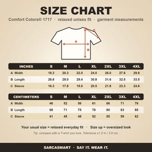 Size chart for the "Pew Pew Madafakas" raccoon meme T-shirt by SarcasmArt (Comfort Colors 1717): relaxed unisex fit, garment measurements in inches and centimeters for sizes S to 4XL.