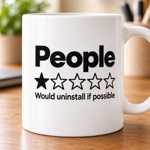 "People – 1 Star, Would Uninstall If Possible" sarcastic coffee mug by SarcasmArt: white 11 oz glossy ceramic mug with the word People with a one-out-of-five-star rating and the review Would uninstall if possible in black, on a desk.