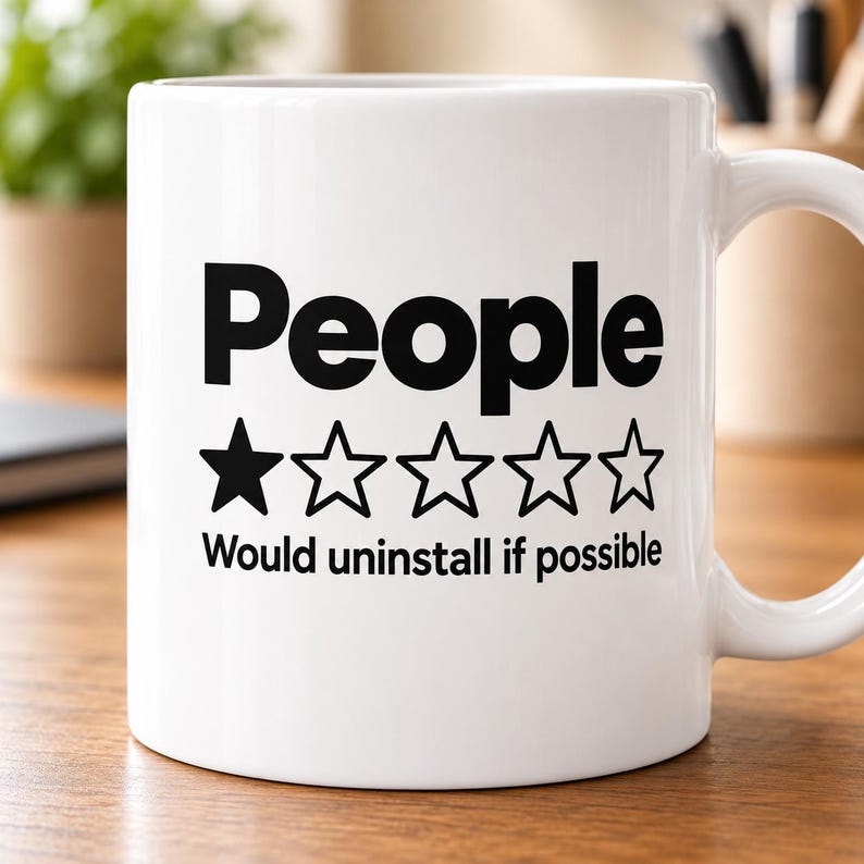 "People – 1 Star, Would Uninstall If Possible" sarcastic coffee mug by SarcasmArt: white 11 oz glossy ceramic mug with the word People with a one-out-of-five-star rating and the review Would uninstall if possible in black, on a desk.