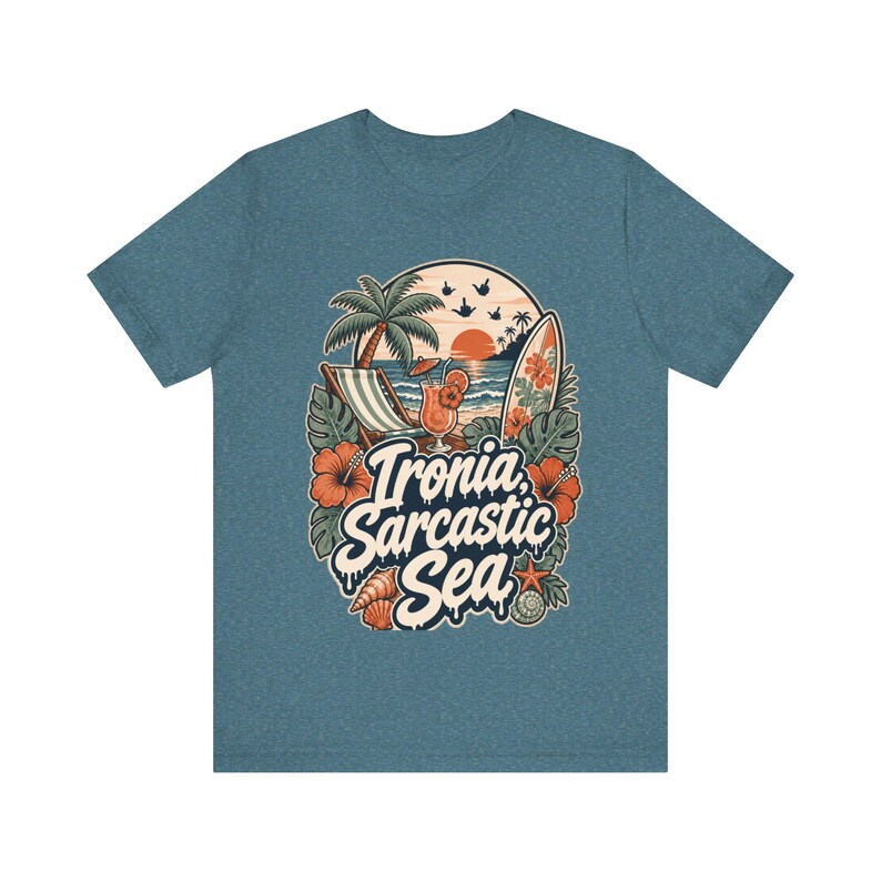 "Ironia, Sarcastic Sea" retro beach T-shirt by SarcasmArt in steel blue on a plain background, showing a vintage tropical beach scene with palm tree, deck chair, cocktail, surfboard, sunset, hibiscus flowers and shells around the script Ironia, Sarcastic Sea.
