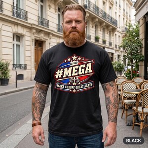 Bearded man in a European old town wearing the "#MEGA Make Europe Great Again" France T-shirt by SarcasmArt in Black.