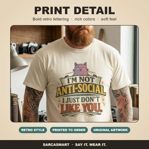 Print detail of the "I'm Not Anti-Social, I Just Don't Like You" sarcastic introvert T-shirt by SarcasmArt: bold retro lettering, rich colors and a soft feel on garment-dyed cotton.