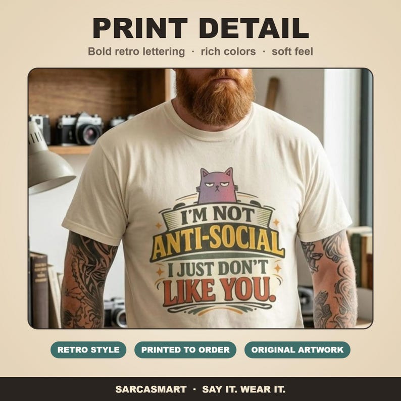 Print detail of the "I'm Not Anti-Social, I Just Don't Like You" sarcastic introvert T-shirt by SarcasmArt: bold retro lettering, rich colors and a soft feel on garment-dyed cotton.