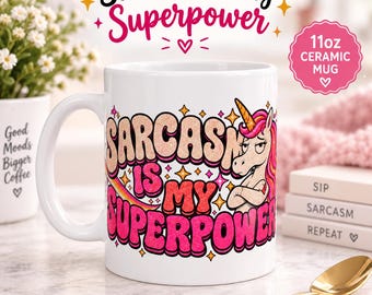 May include: A white 11oz ceramic mug featuring a graphic of a unicorn with crossed arms and a skeptical expression. The text reads Sarcasm Is My Superpower in bold, glittery pink and orange lettering, surrounded by small yellow star icons.